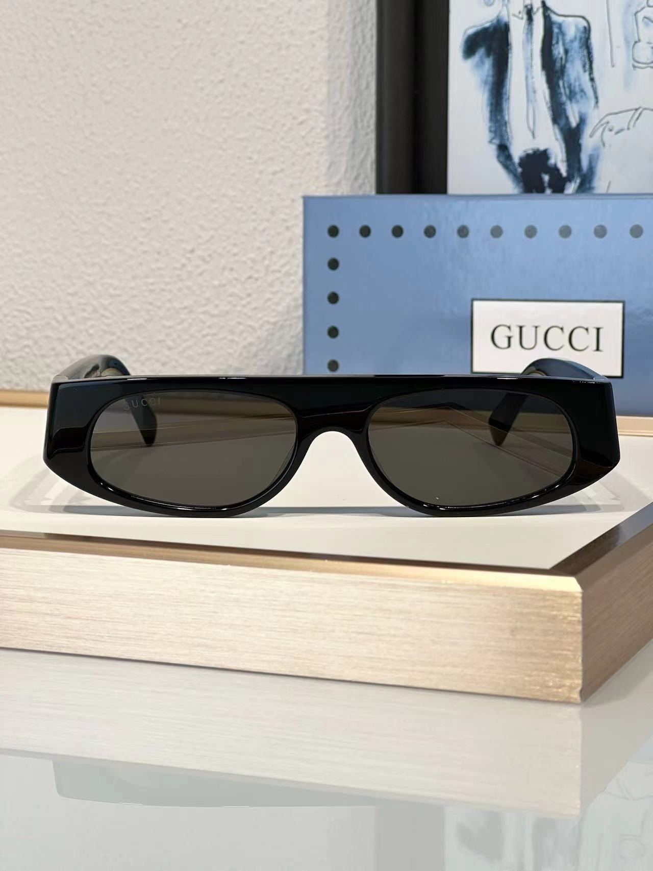 G*u*i sunglasses