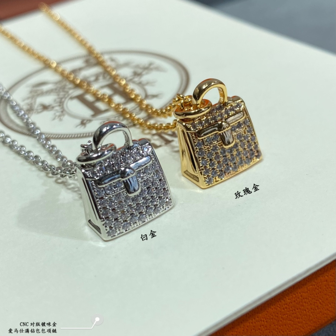 H**mes fully di*m*nd-encrusted bag necklace