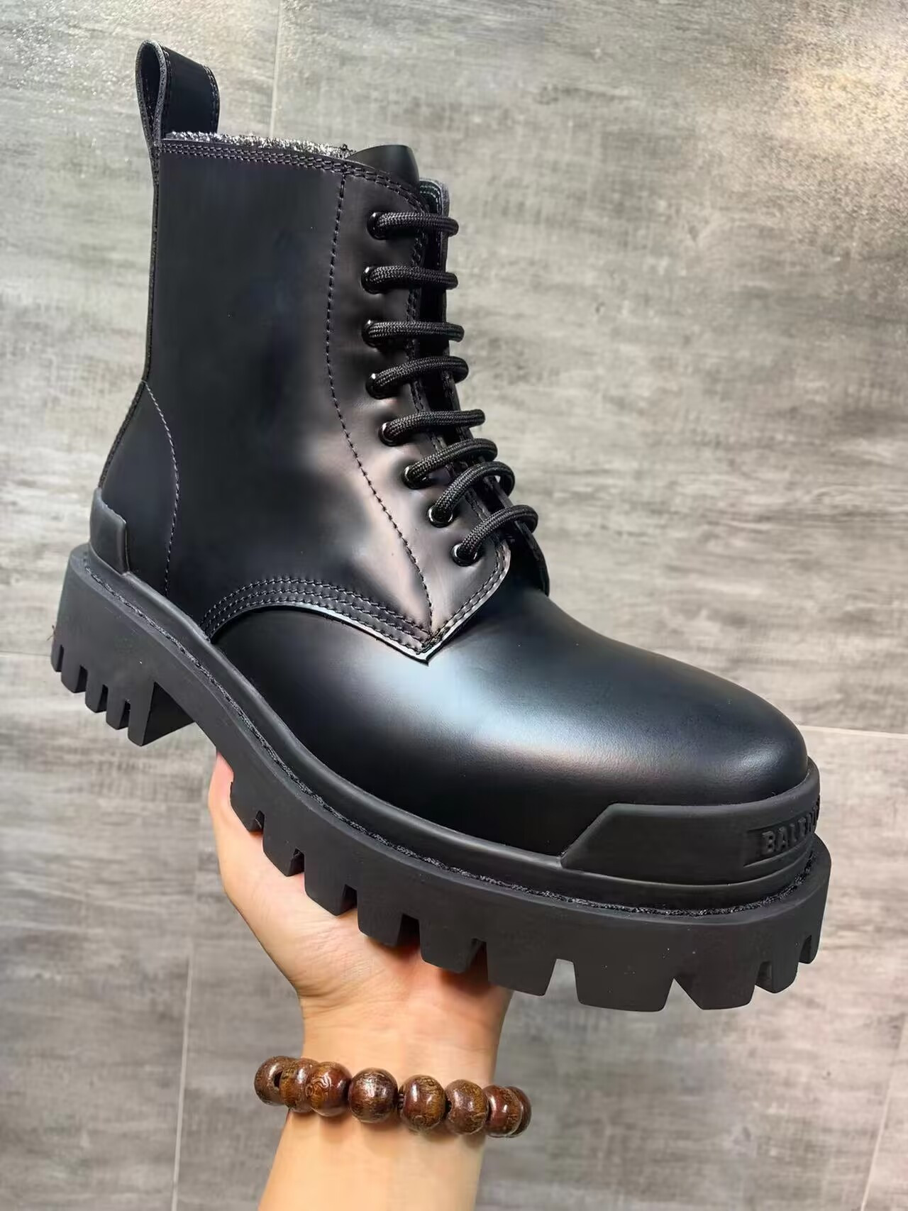 ua Ba*len*cia*ga strike lace-up boot in black
