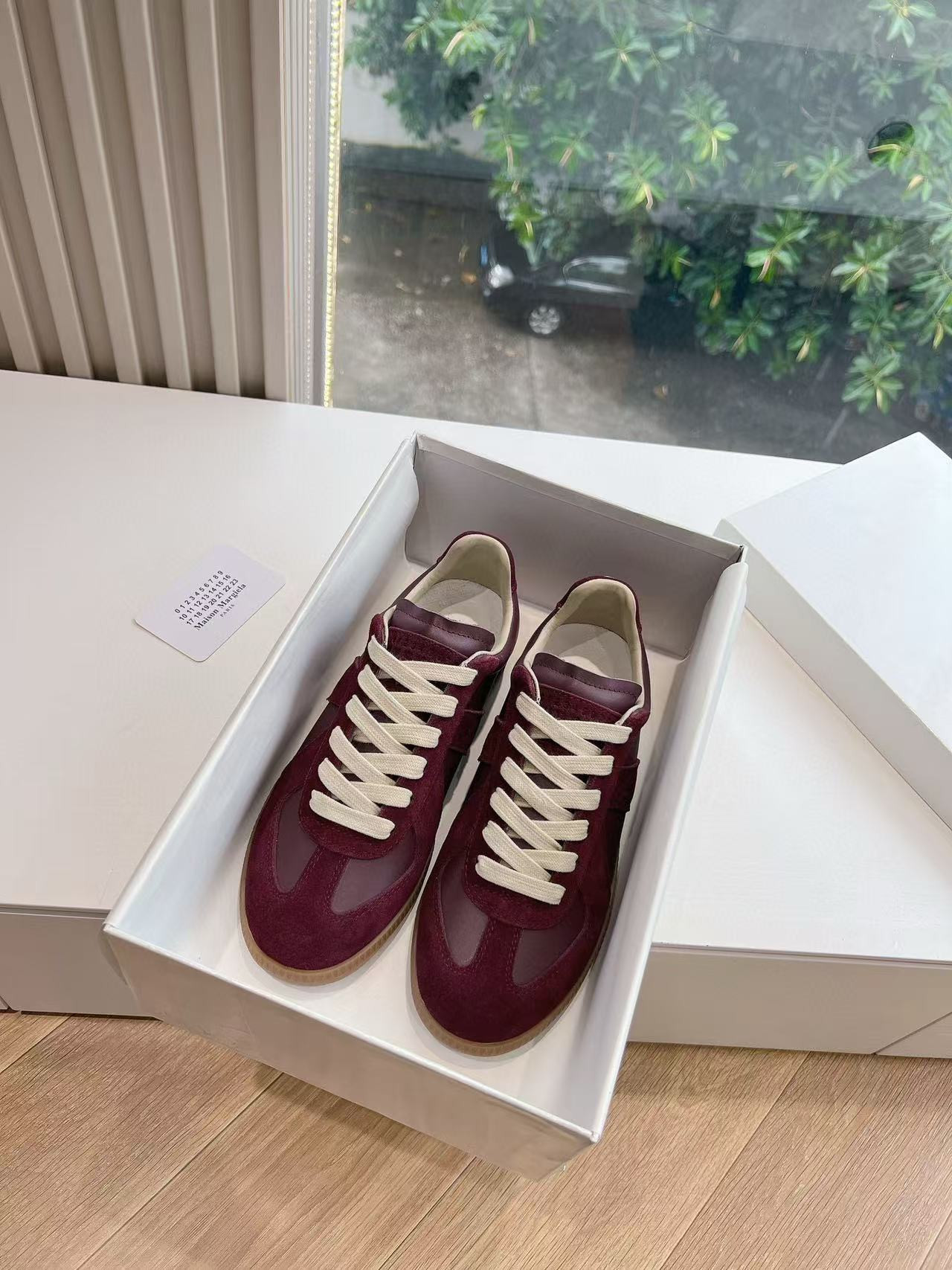 ua ma*s*n Ma*i*la mm6 sneakers