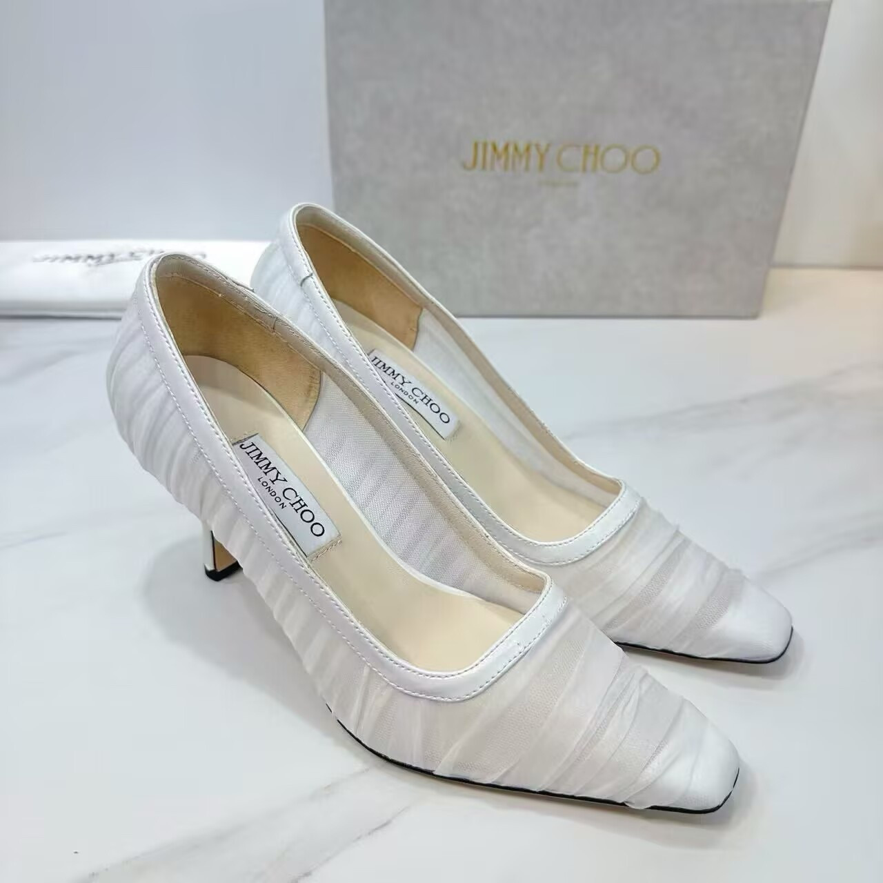 ua Ji*y Ch* ivory tulle and nappa pumps