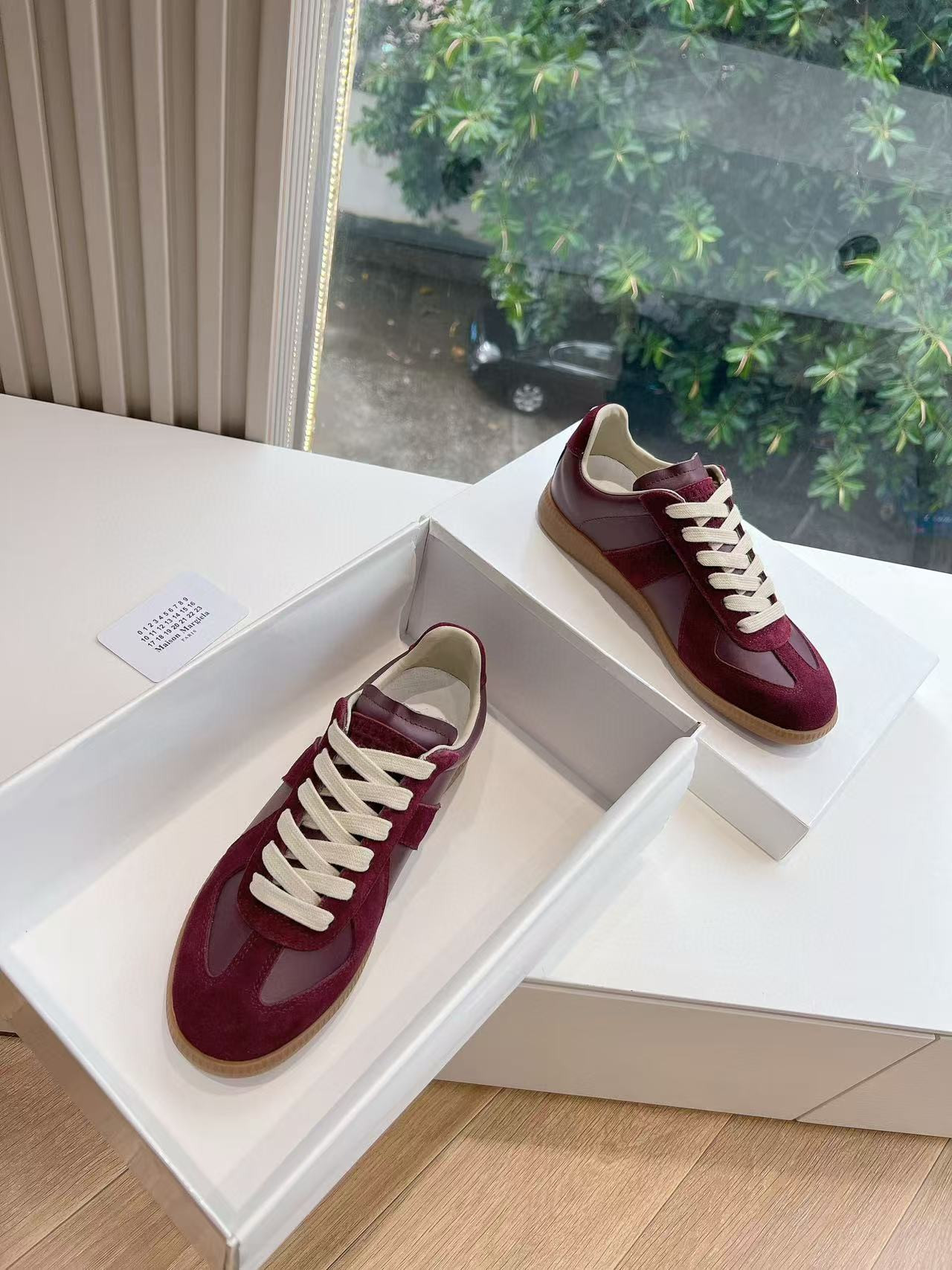 ua ma*s*n Ma*i*la mm6 sneakers