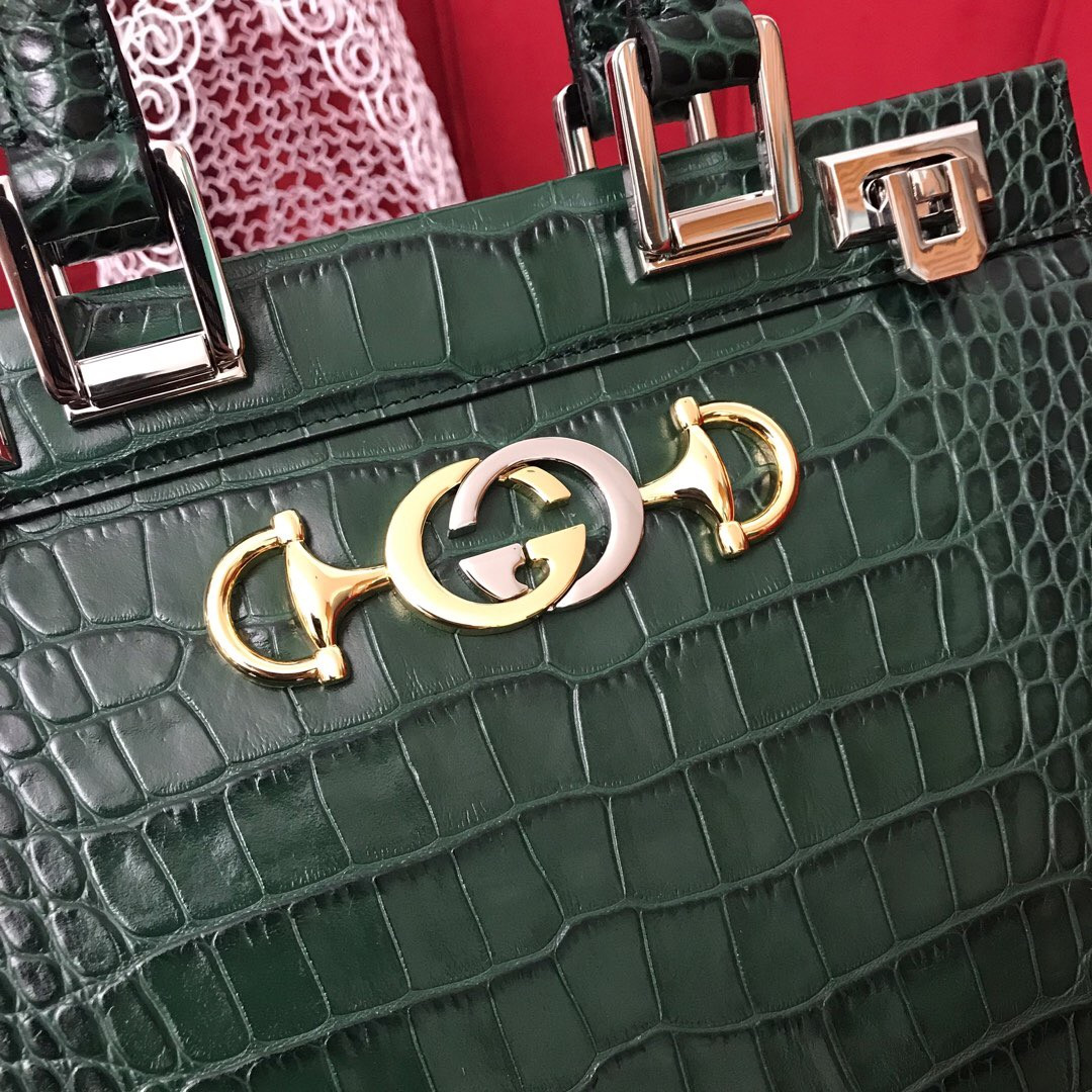 G*u*i zumi leather medium top handle bag