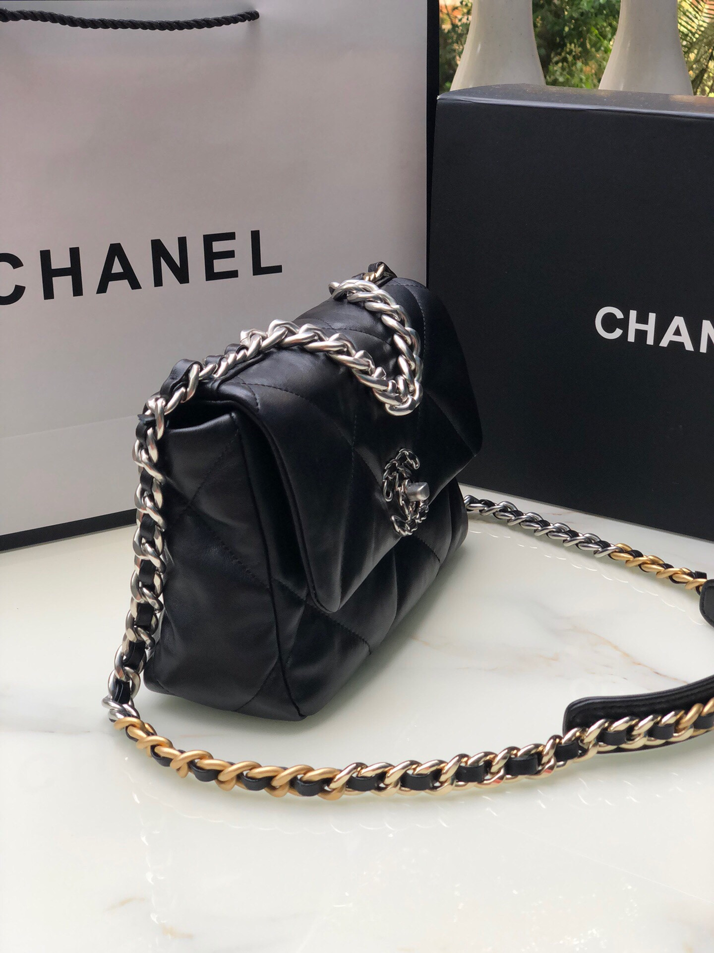 Ch*el 19 handbag shiny leather, gold-tone, silver-tone & ruthenium-finish metal black 6.2 × 10.1 × 3.5 in