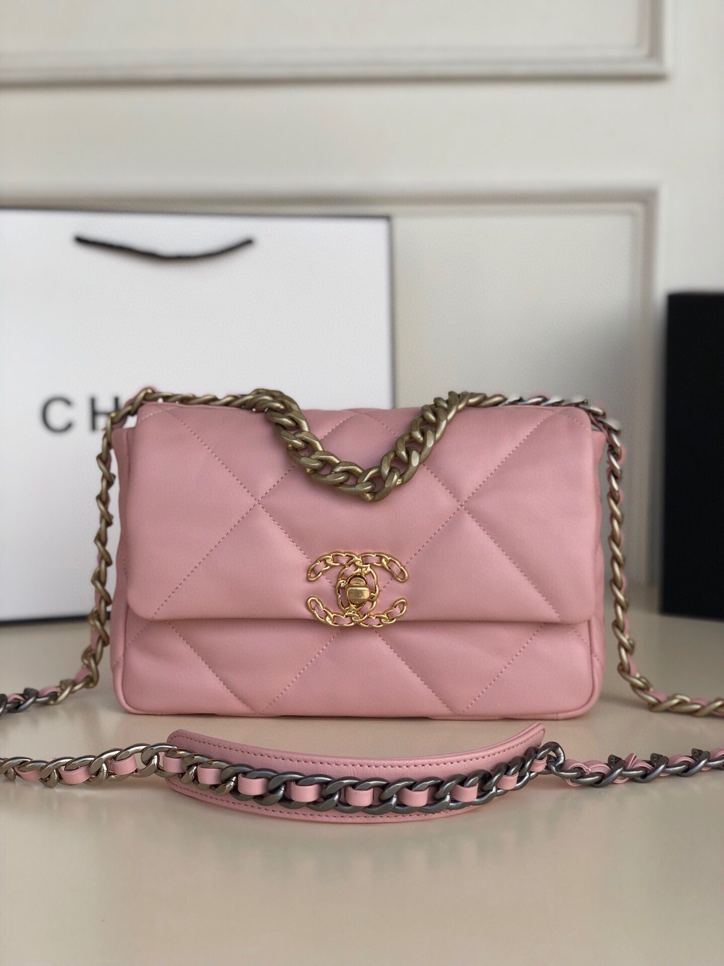 Ch*el 19 handbag shiny leather, gold-tone, silver-tone & ruthenium-finish metal light pink 6.2 × 10.1 × 3.5 in
