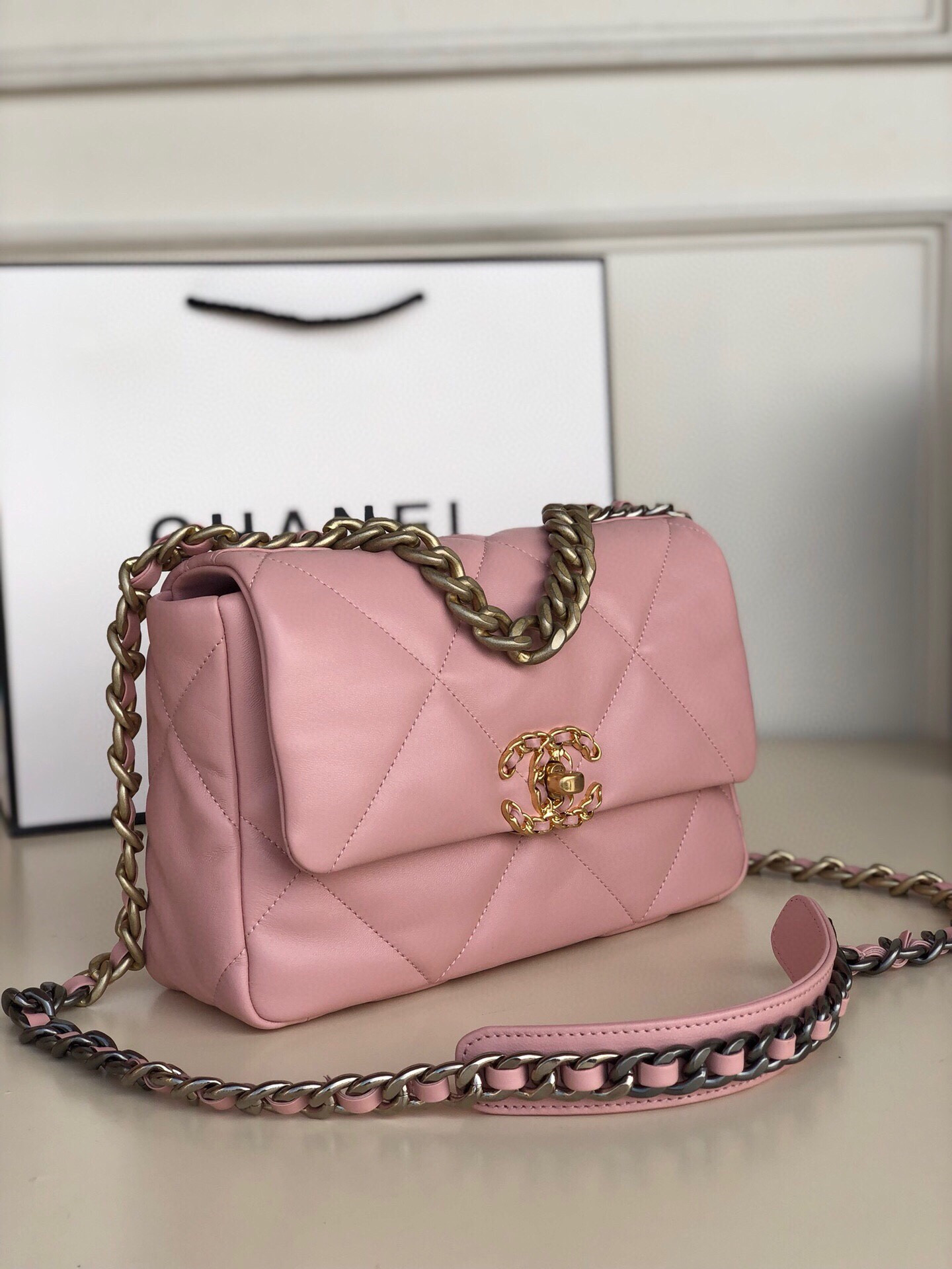 Ch*el 19 handbag shiny leather, gold-tone, silver-tone & ruthenium-finish metal light pink 6.2 × 10.1 × 3.5 in