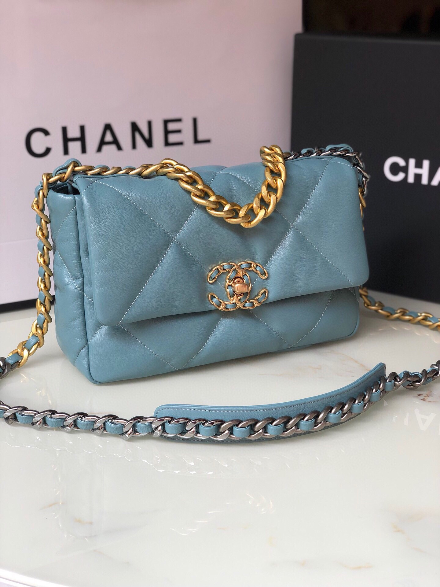 Ch*el 19 handbag shiny leather, gold-tone, silver-tone & ruthenium-finish metal blue 6.2 × 10.1 × 3.5 in