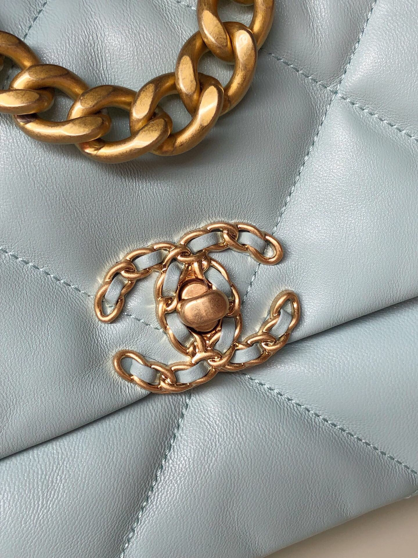 Ch*el 19 handbag shiny leather, gold-tone, silver-tone & ruthenium-finish metal light blue 6.2 × 10.1 × 3.5 in