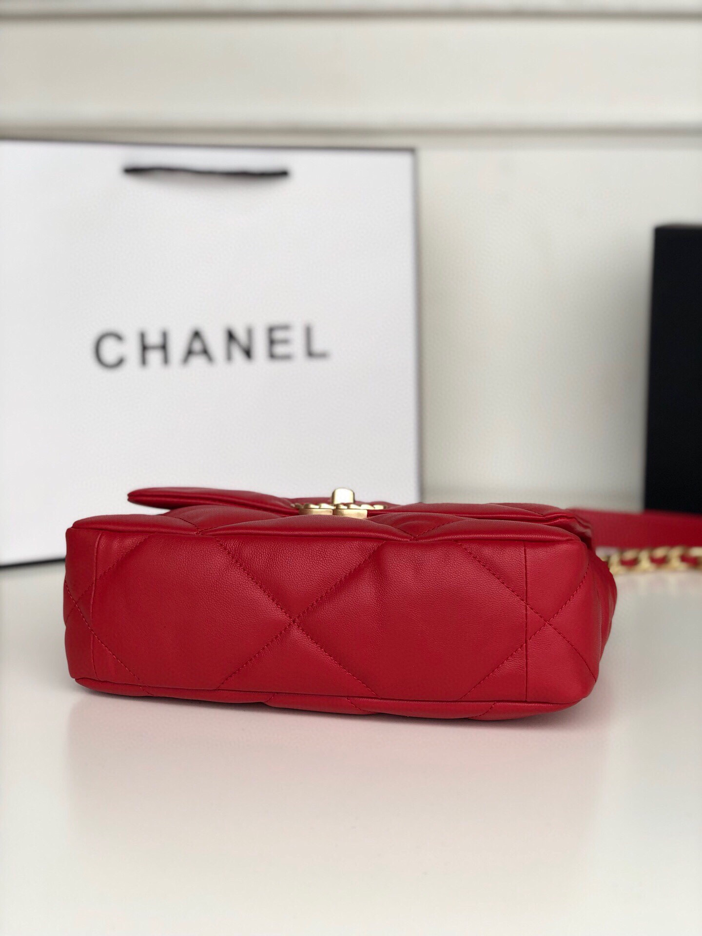 Ch*el 19 handbag shiny leather, gold-tone, silver-tone & ruthenium-finish metal red 6.2 × 10.1 × 3.5 in