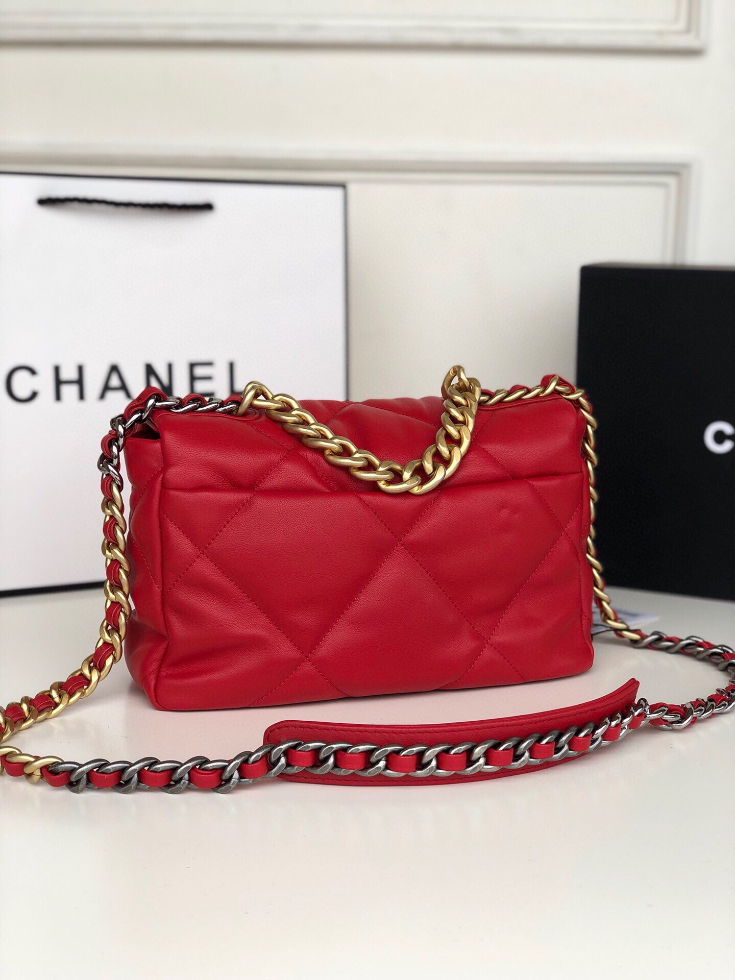 Ch*el 19 handbag shiny leather, gold-tone, silver-tone & ruthenium-finish metal red 6.2 × 10.1 × 3.5 in