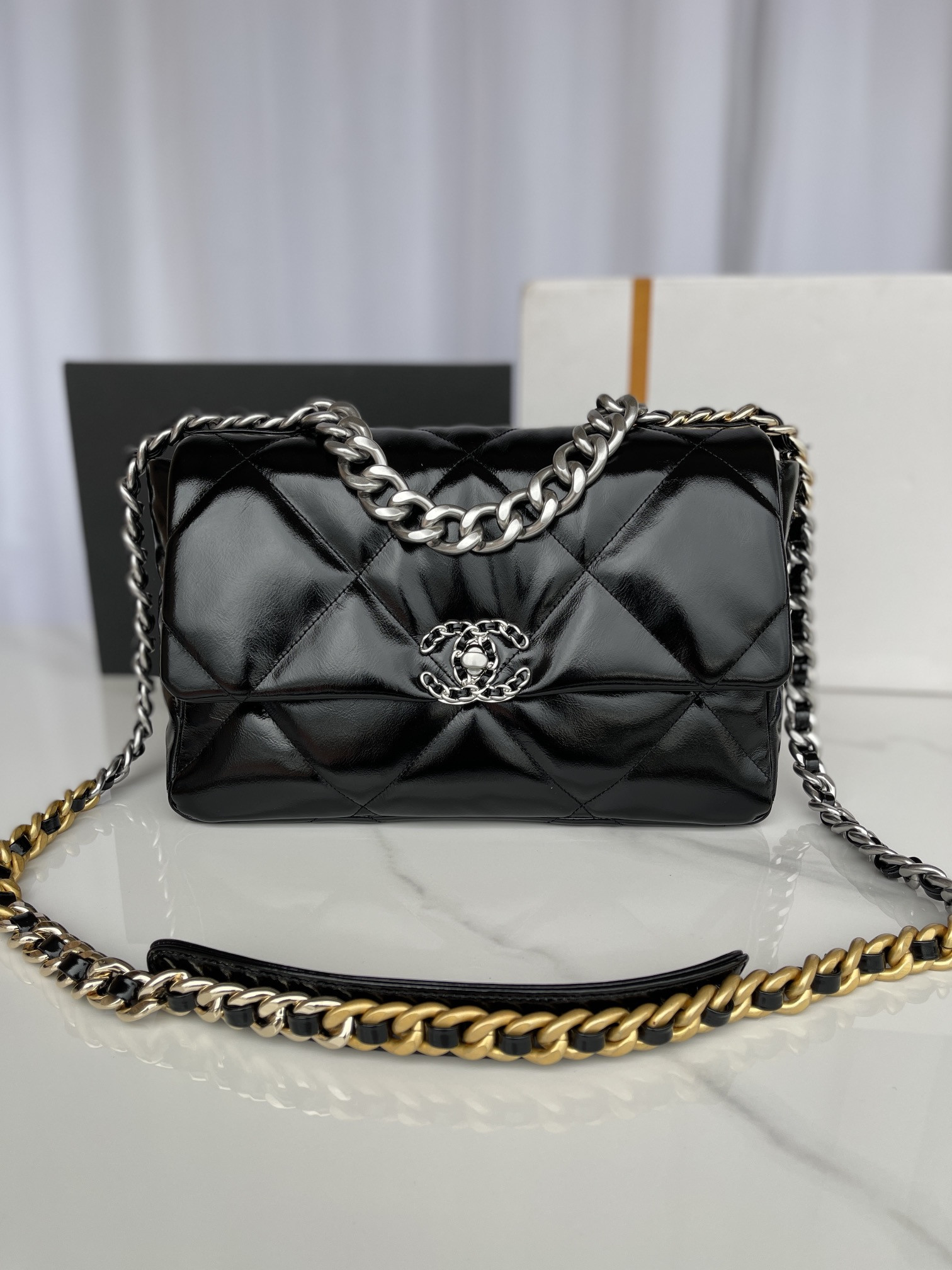 Ch*el 19 large handbag shiny leather, gold-tone, silver-tone & ruthenium-finish metal black 7.8 × 11.7 × 3.9 in