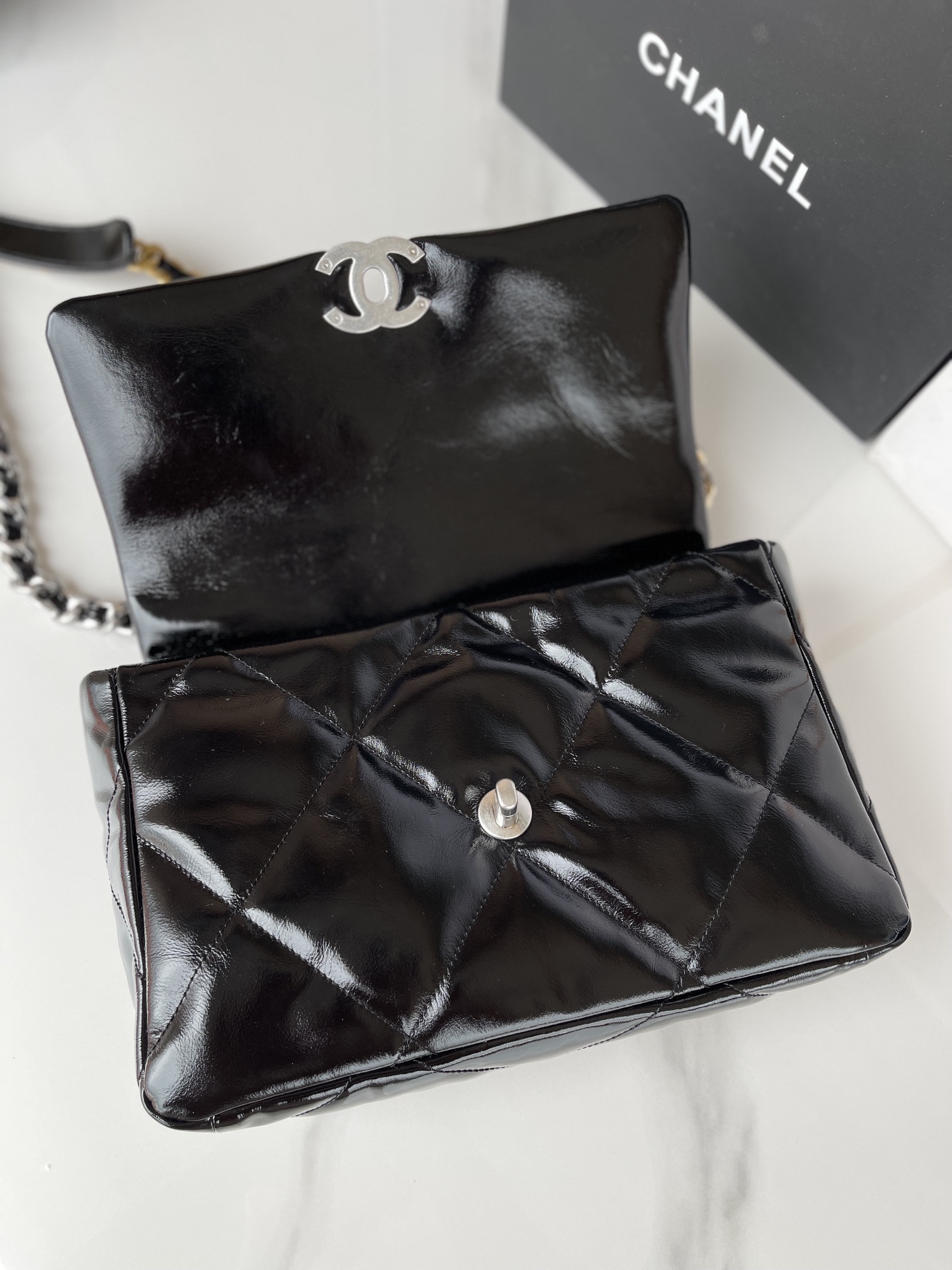 Ch*el 19 large handbag shiny leather, gold-tone, silver-tone & ruthenium-finish metal black 7.8 × 11.7 × 3.9 in