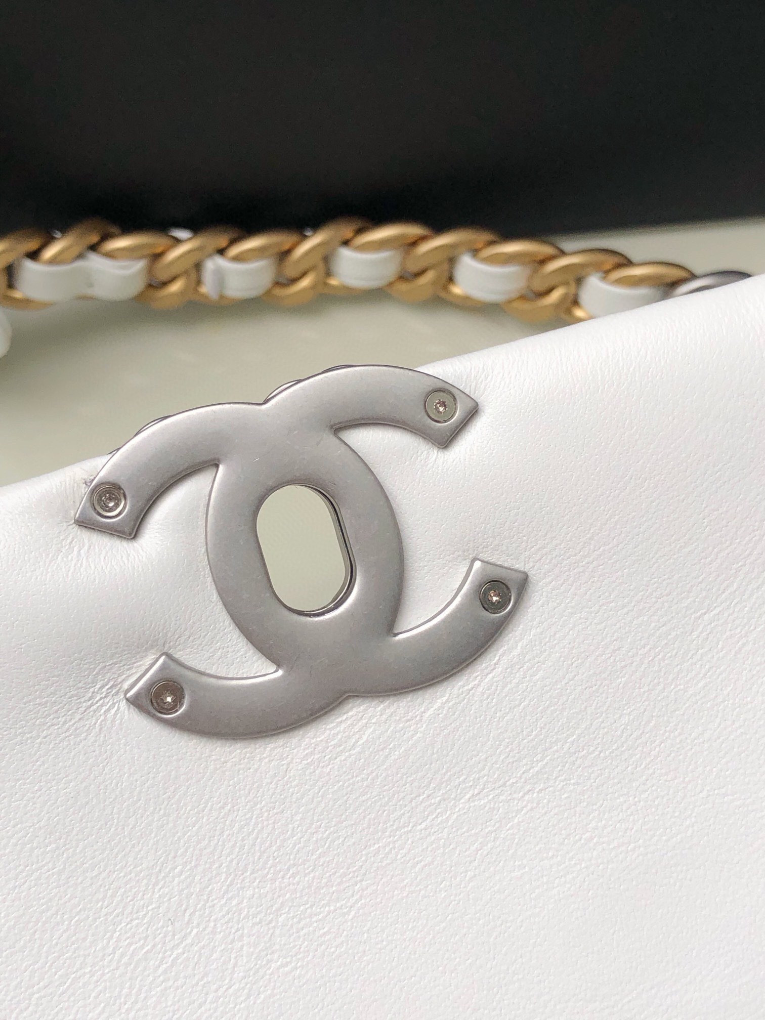 Ch*el 19 large handbag shiny leather, gold-tone, silver-tone & ruthenium-finish metal white 7.8 × 11.7 × 3.9 in