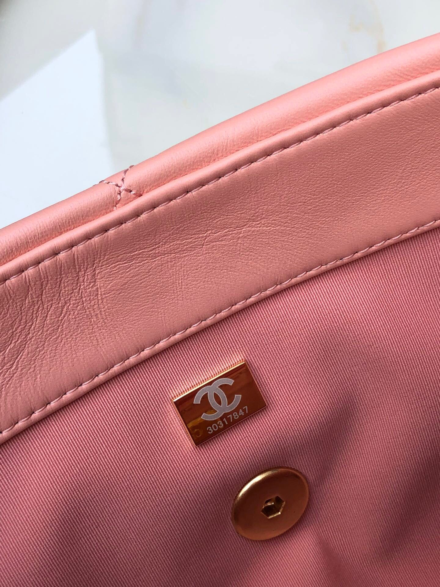 Ch*el 19 large handbag shiny leather, gold-tone, silver-tone & ruthenium-finish metal light pink 7.8 × 11.7 × 3.9 in