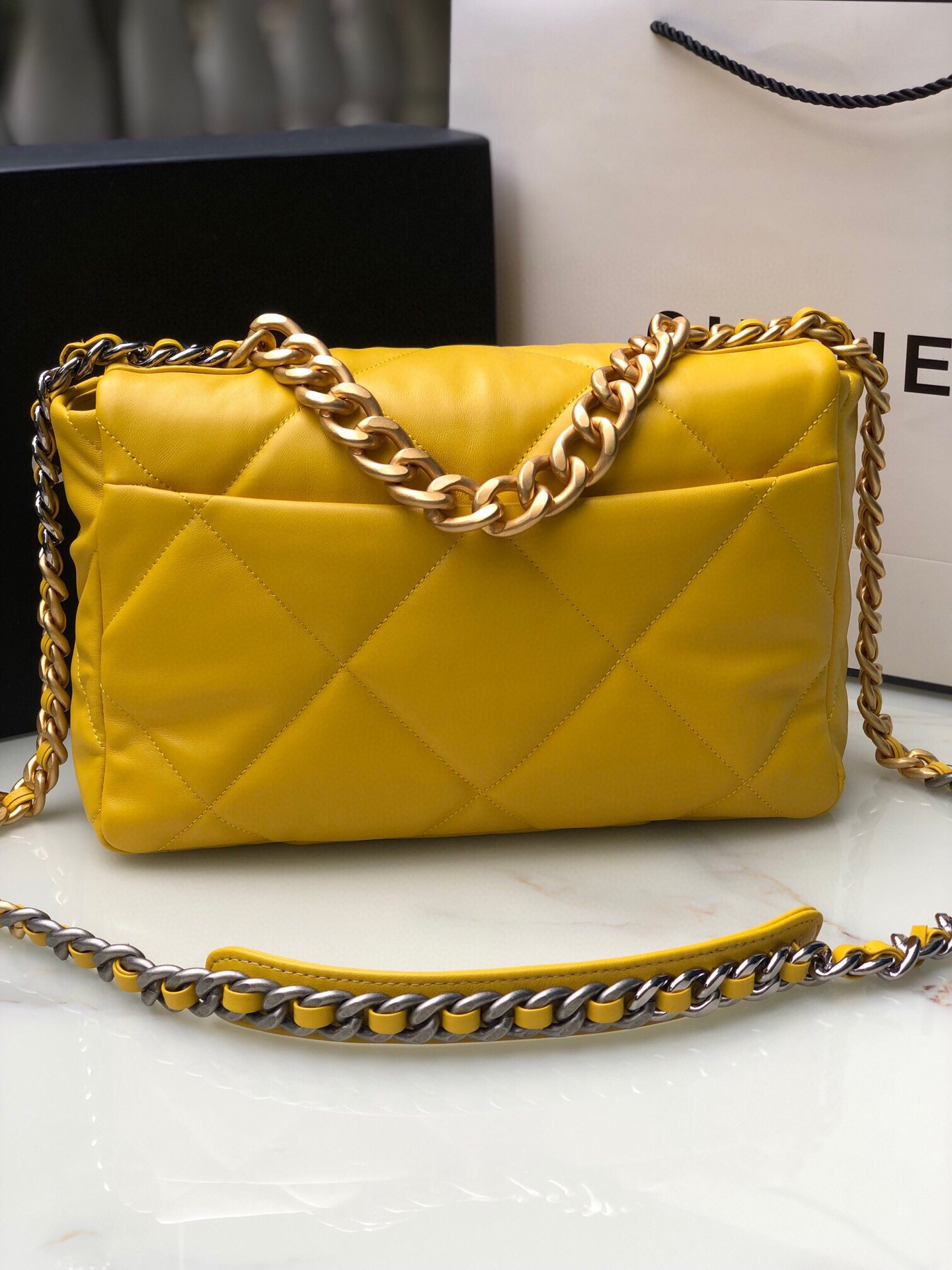 Ch*el 19 large handbag shiny leather, gold-tone, silver-tone & ruthenium-finish metal yellow 7.8 × 11.7 × 3.9 in