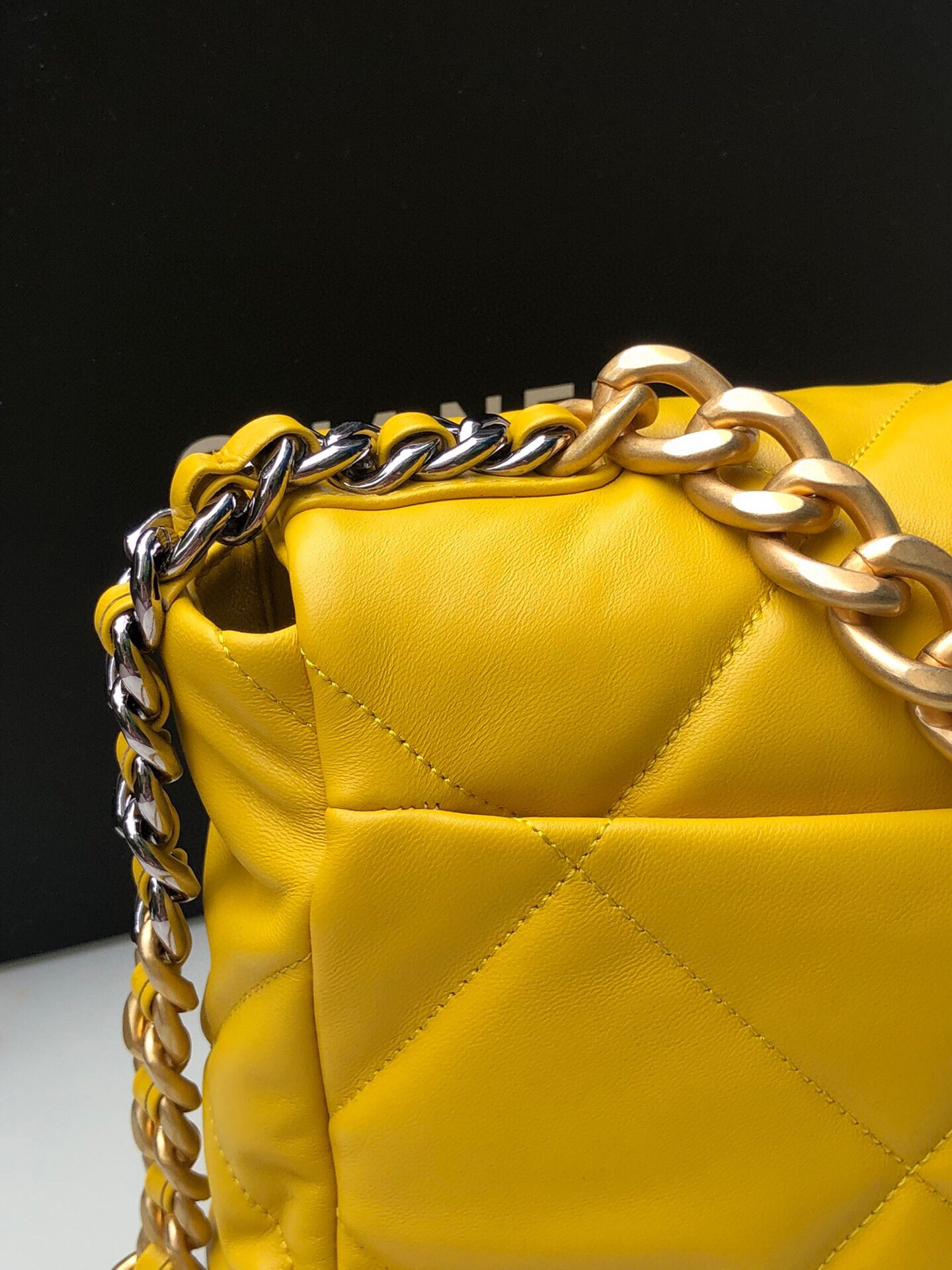Ch*el 19 large handbag shiny leather, gold-tone, silver-tone & ruthenium-finish metal yellow 7.8 × 11.7 × 3.9 in