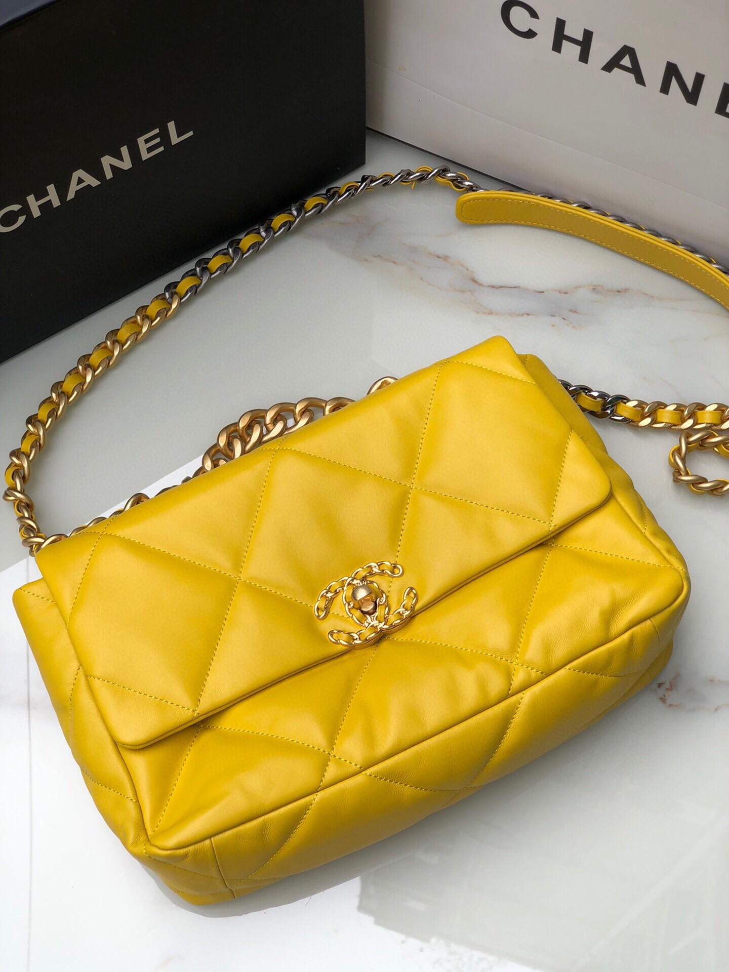 Ch*el 19 large handbag shiny leather, gold-tone, silver-tone & ruthenium-finish metal yellow 7.8 × 11.7 × 3.9 in