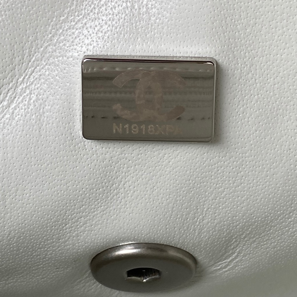 Ch*el mini flap bag shiny calfskin & silver-tone metal white 4.7 × 7.8 × 2.3 in