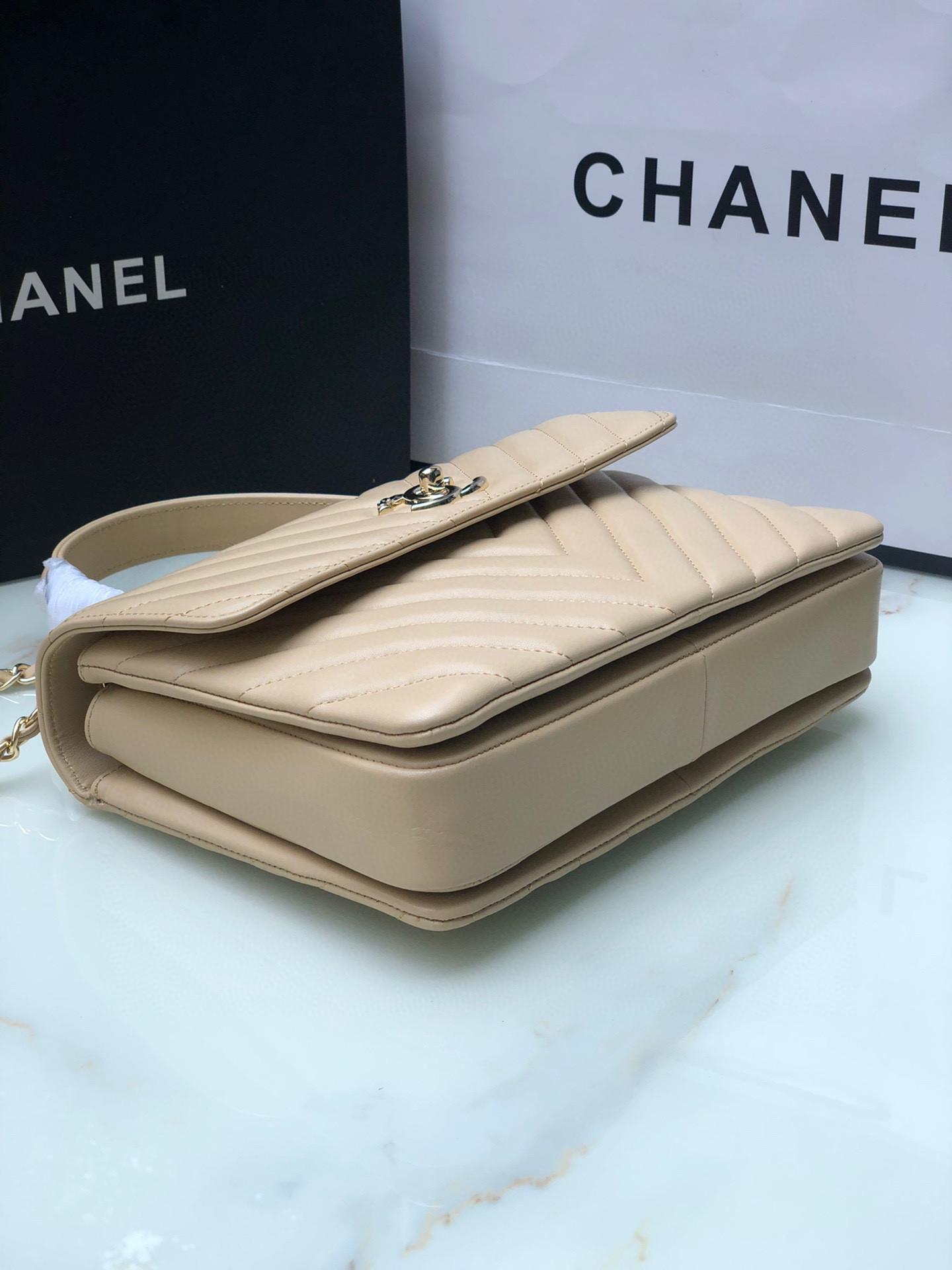 Ch*el flap bag with top handle beige 6.6 × 9.8 × 4.7 in
