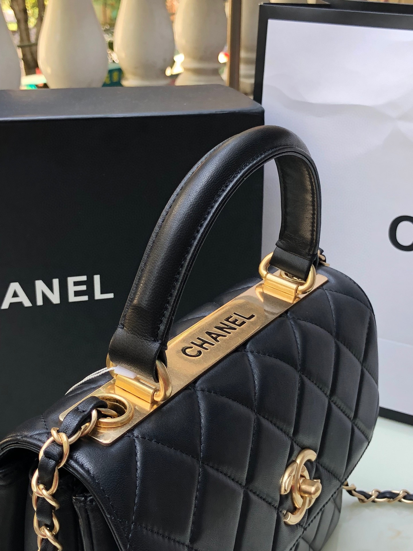 Ch*el flap bag with top handle 6.6 × 9.8 × 4.7 in