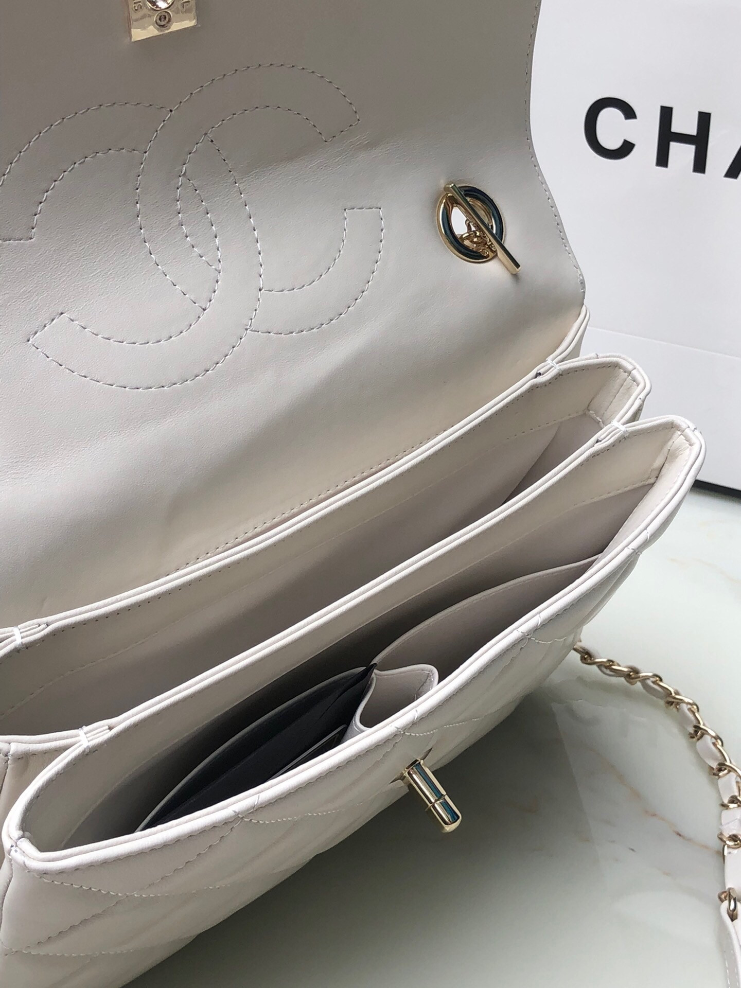 Ch*el flap bag with top handle 6.6 × 9.8 × 4.7 in