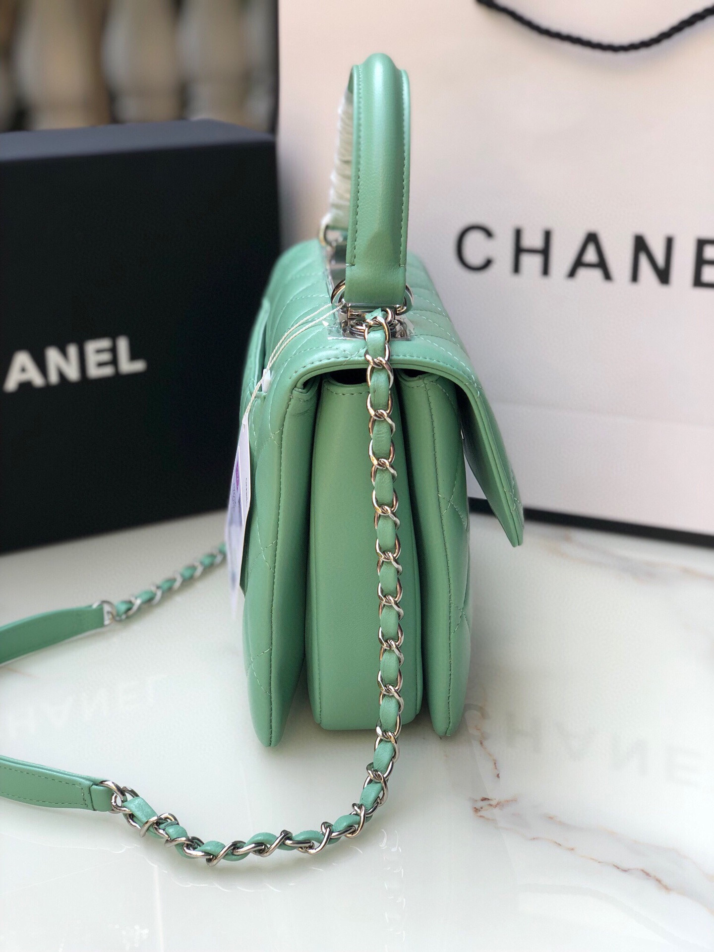 Ch*el flap bag with top handle 6.6 × 9.8 × 4.7 in
