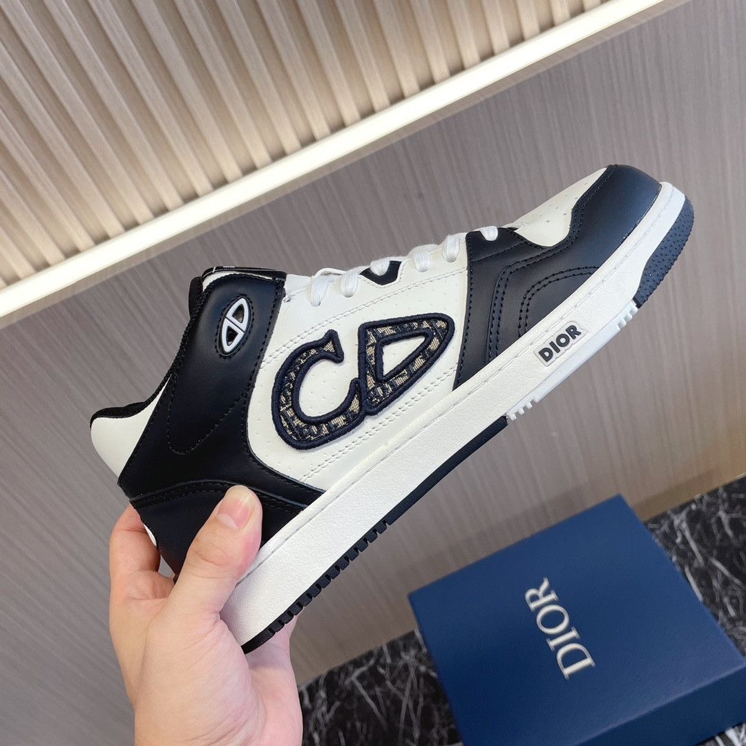 ua D*or b57 mid-top sneaker black and white