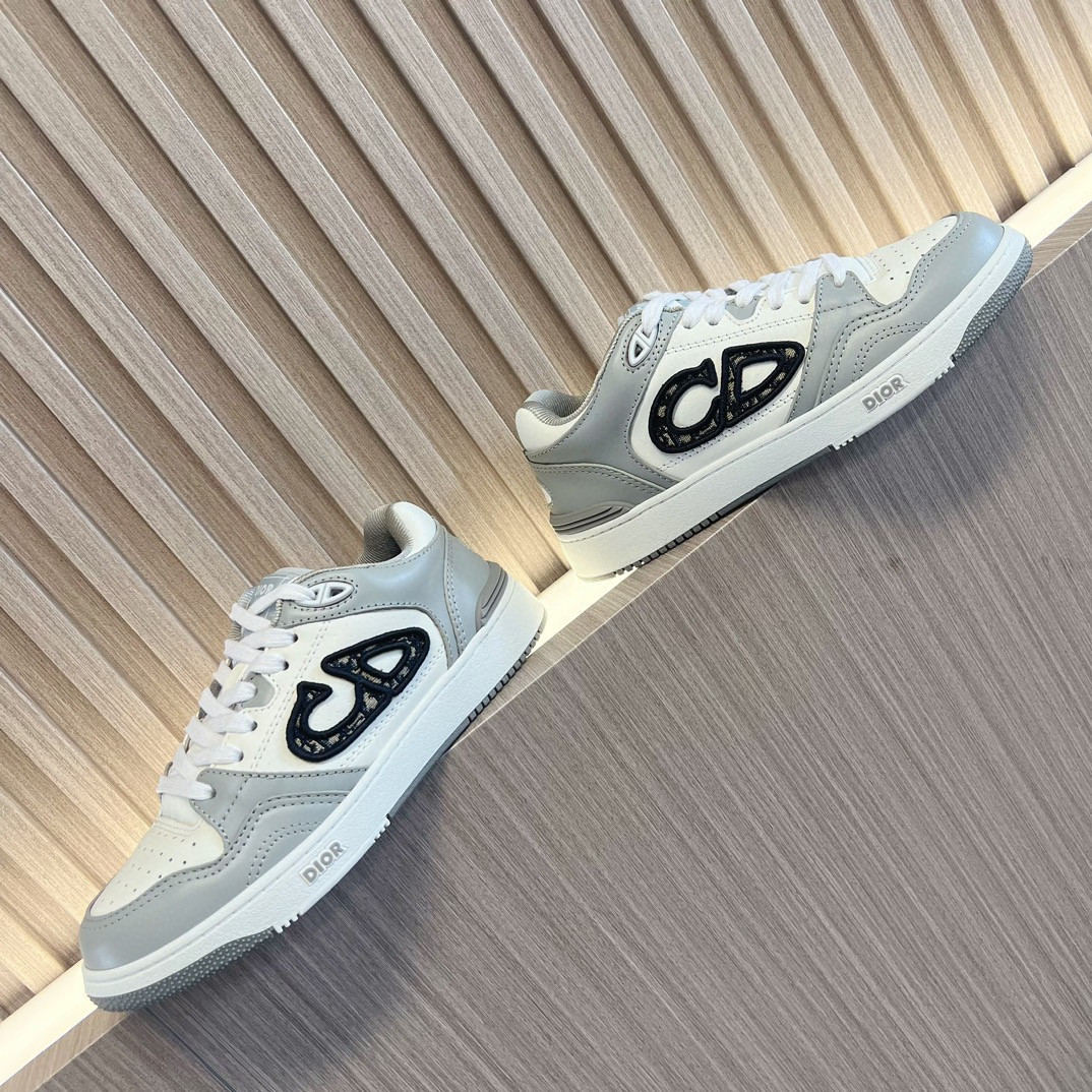 ua D*or b57 low-top sneaker gray and white